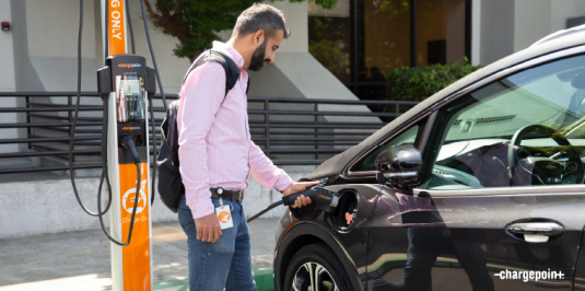 Person charging their car using ChargePoint CT4000