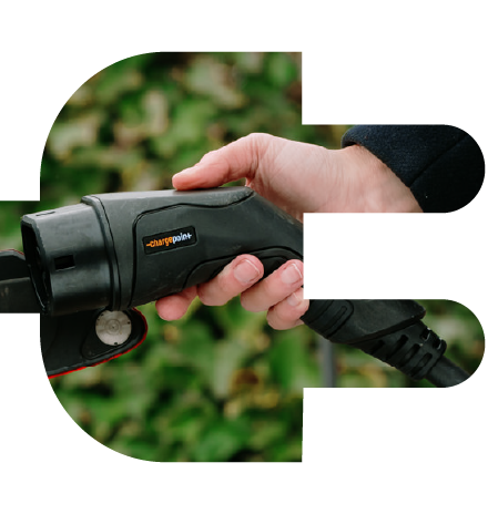 Hand holding ChargePoint charging port