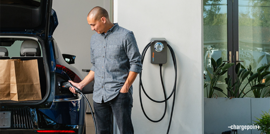Person charging their car using ChargePoint Home Flex